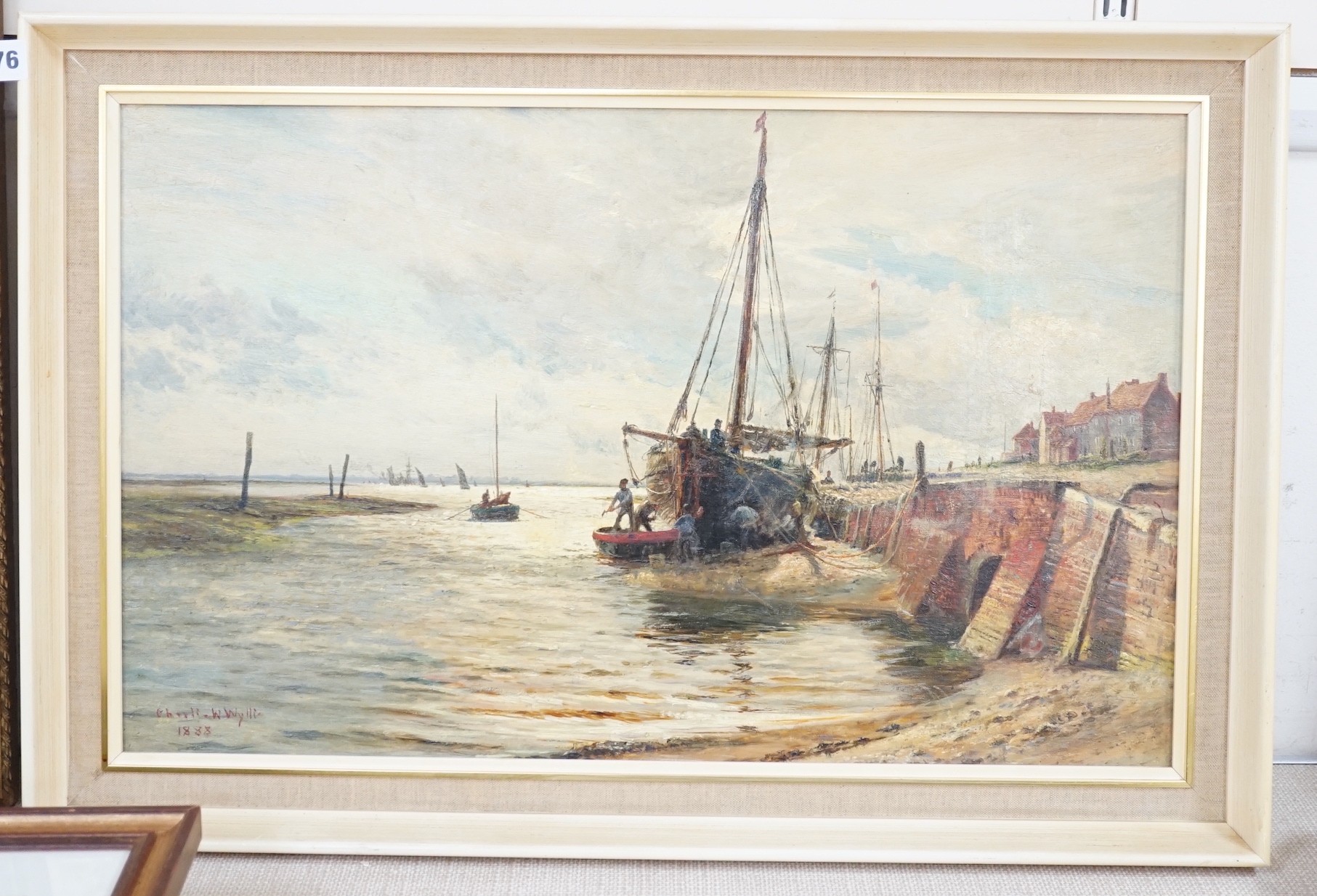 Charles William Wyllie (1853-1923), oil on board, Fishing boat along the wharf at low tide, signed and dated 1888, 37 x 60cm